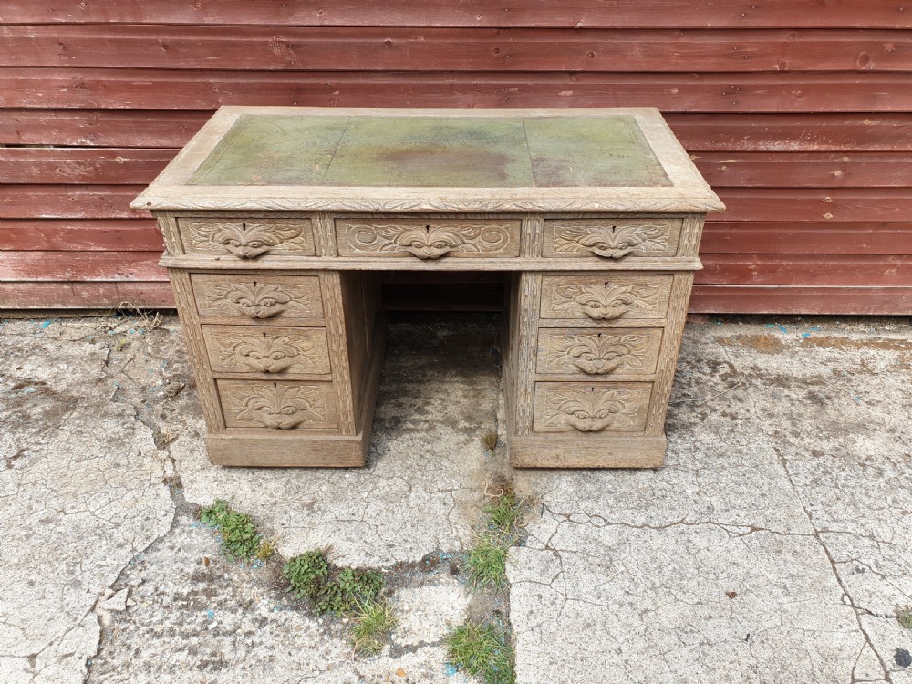 Early 20th century carved oak kneehole pedestal desk  View III