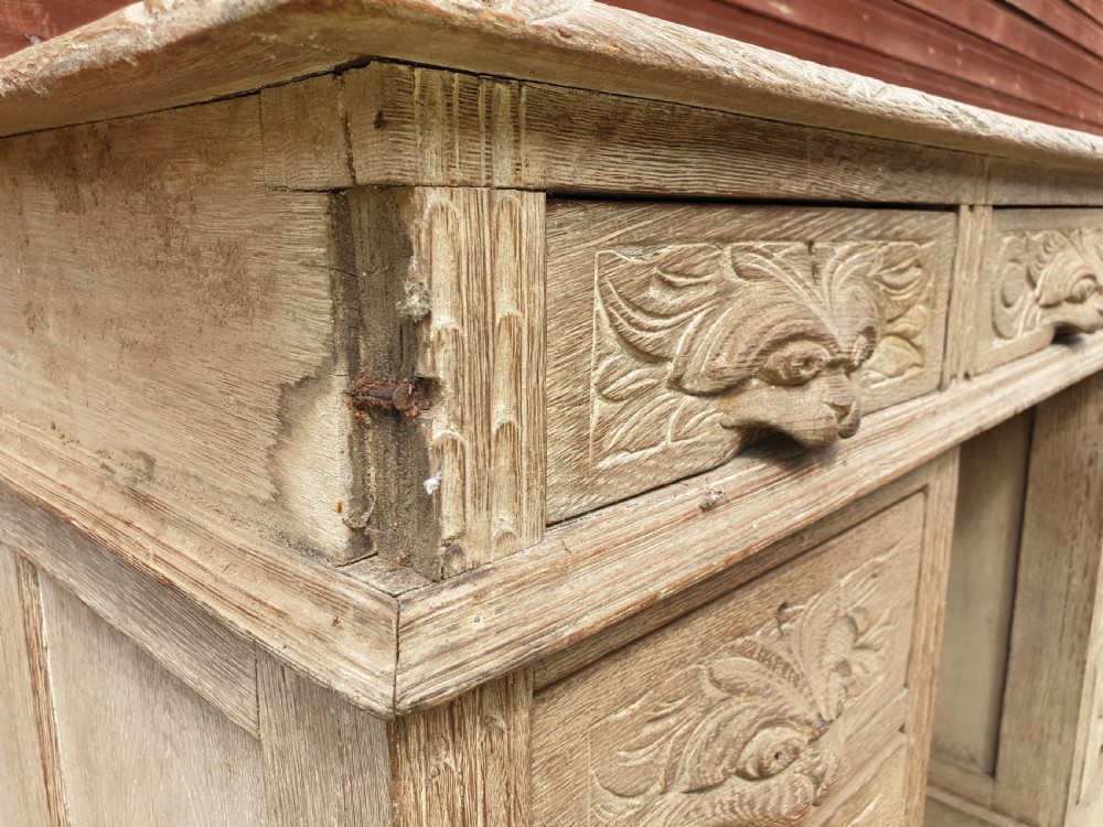 Early 20th century carved oak kneehole pedestal desk  View IV