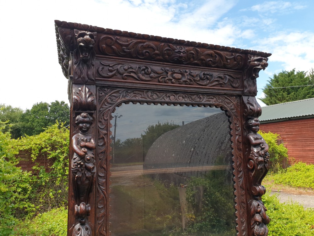 Well carved late Victorian oak cupboard  View II