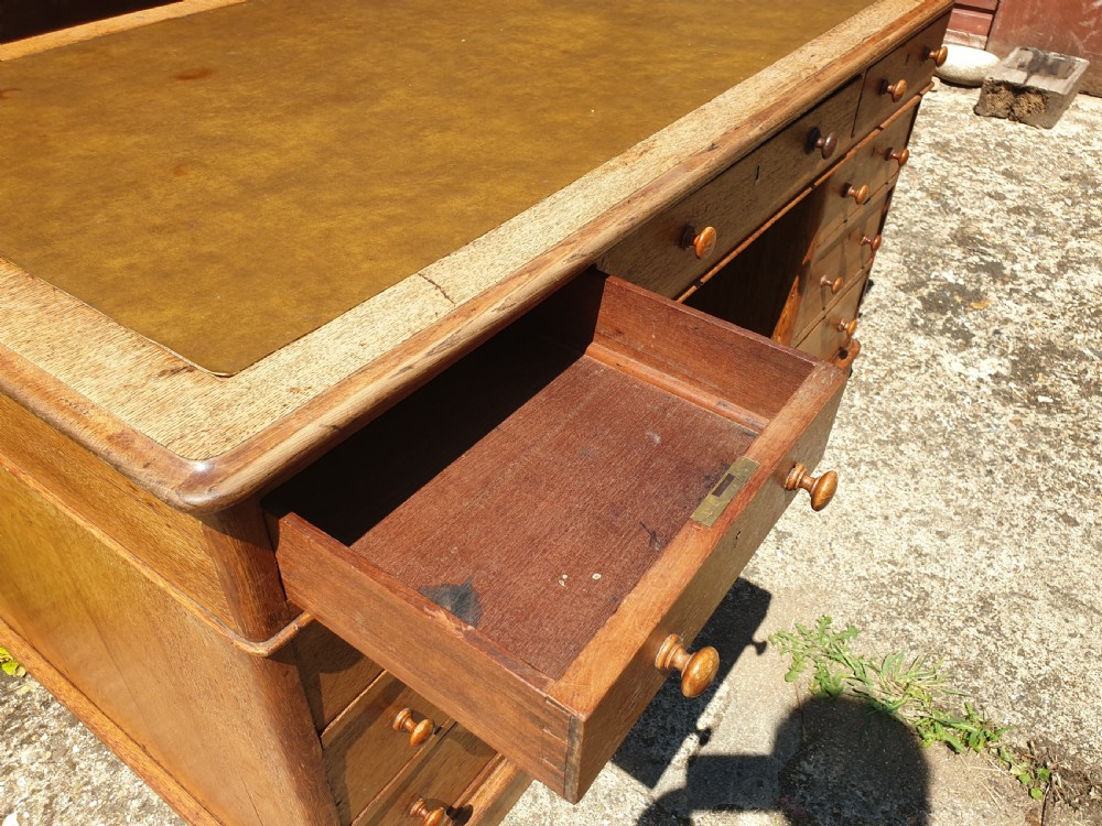 Late Victorian oak kneehole pedestal desk of good size. View IV