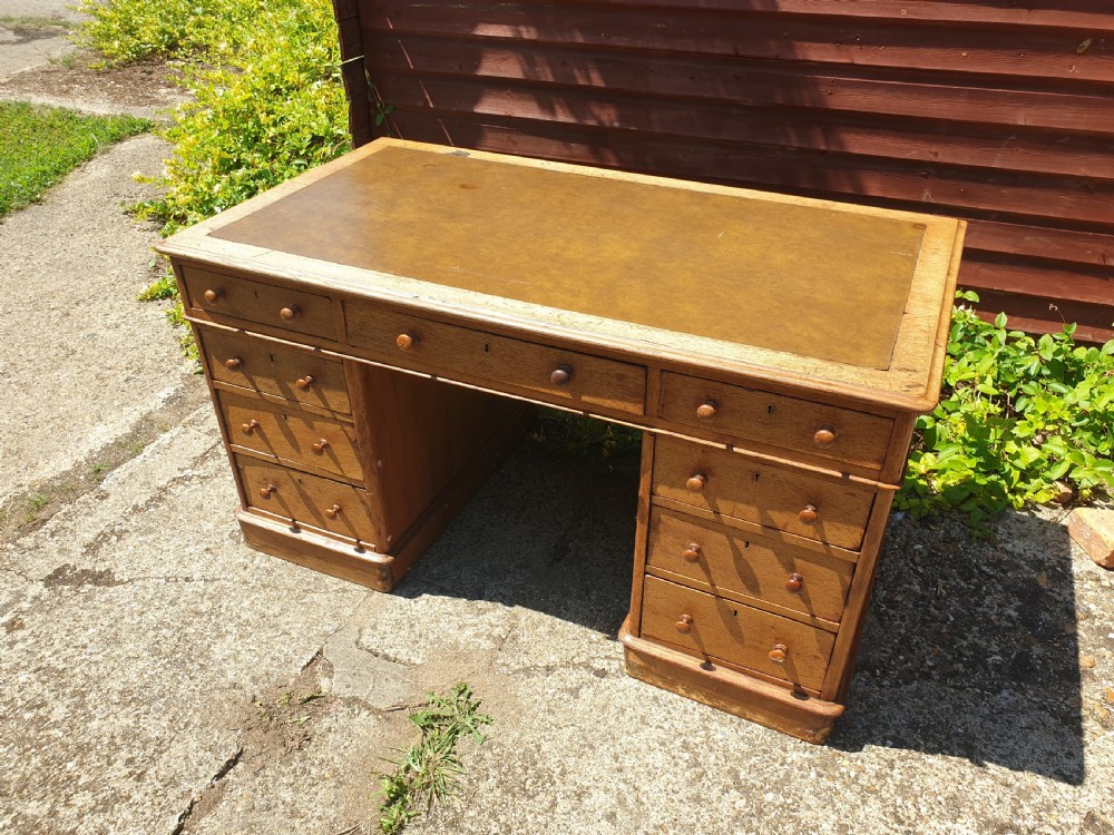 Late Victorian oak kneehole pedestal desk of good size. View VI