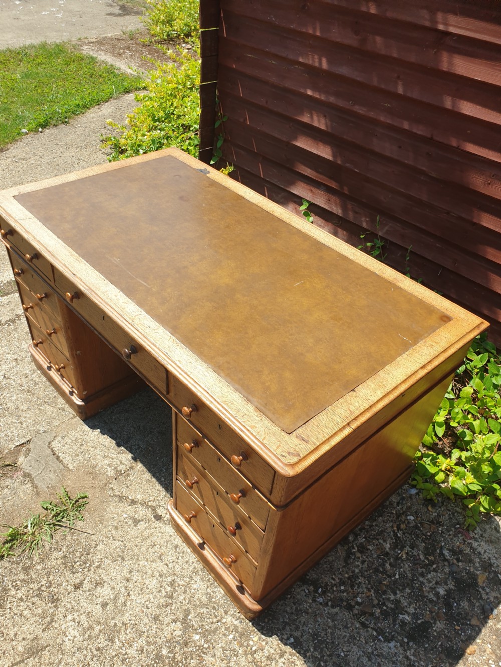 Late Victorian oak kneehole pedestal desk of good size. View VIII