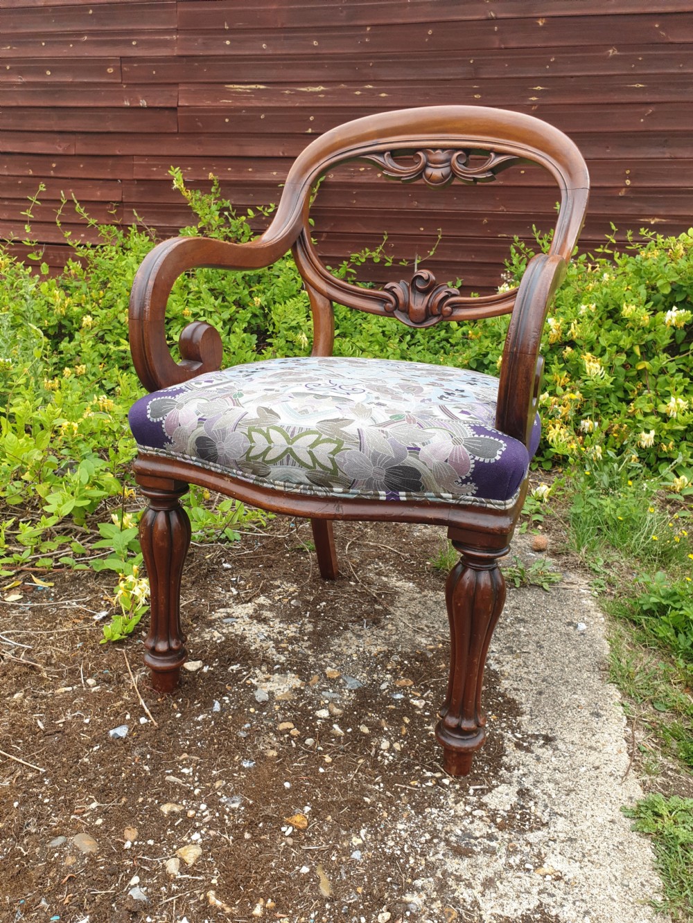 Mid 19th century scroll arm mahogany desk armchair.  View III