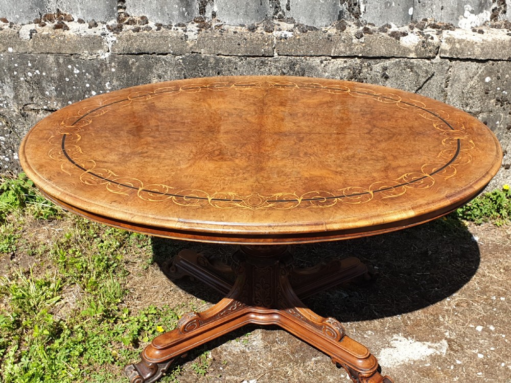 Victorian inlaid walnut pedestal tip top table.