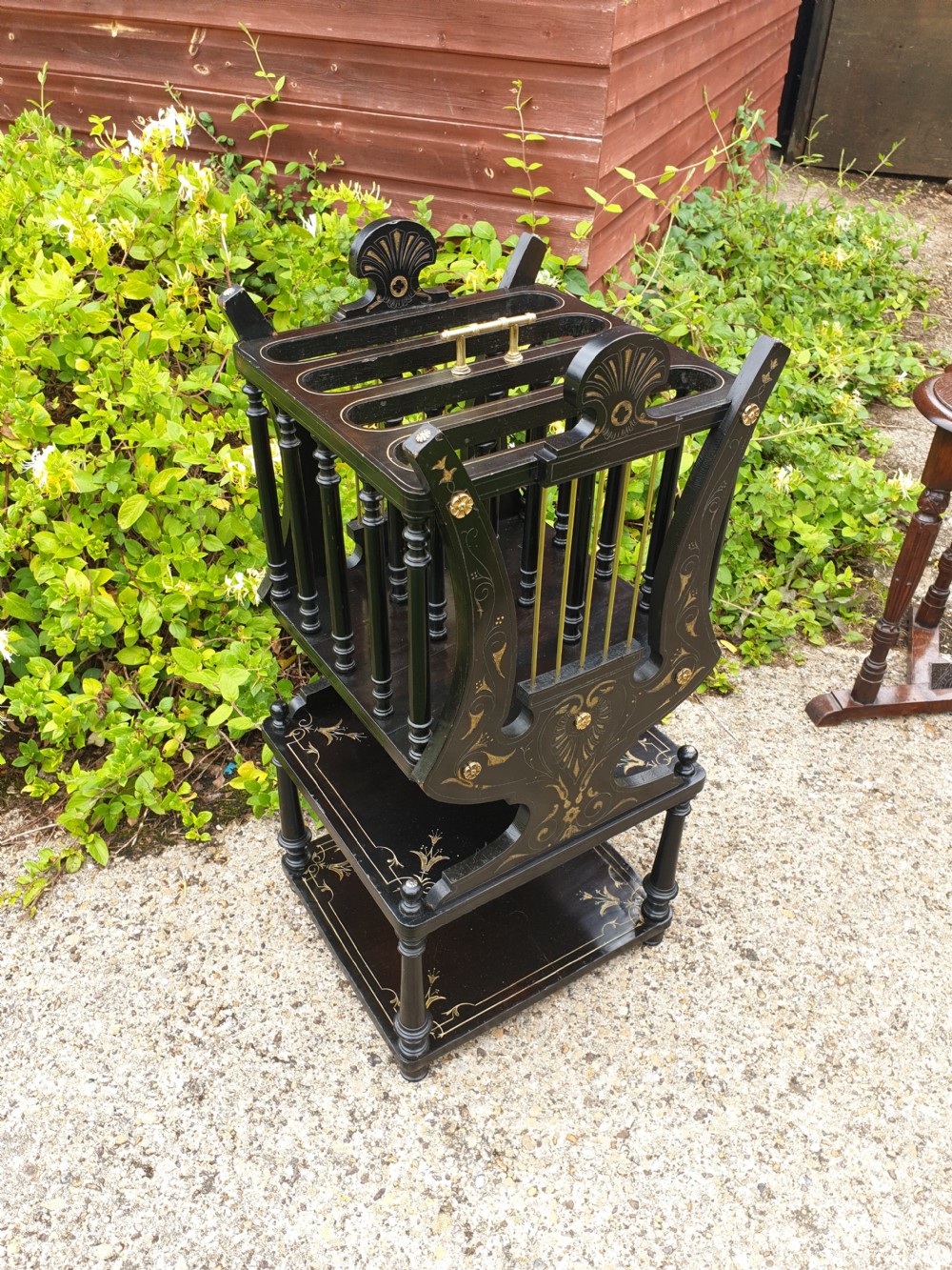 Victorian ebonised and gilt Canterbury table.  View V