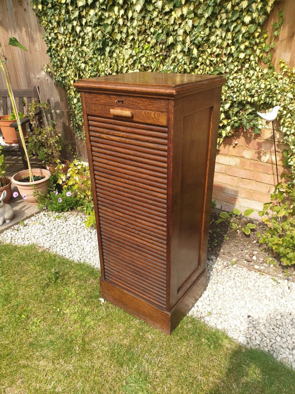 Early 20th century oak tambour front office cabinet. 