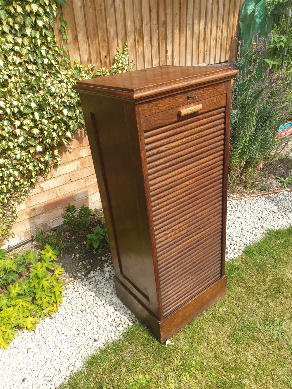 Early 20th century oak tambour front office cabinet.  View III