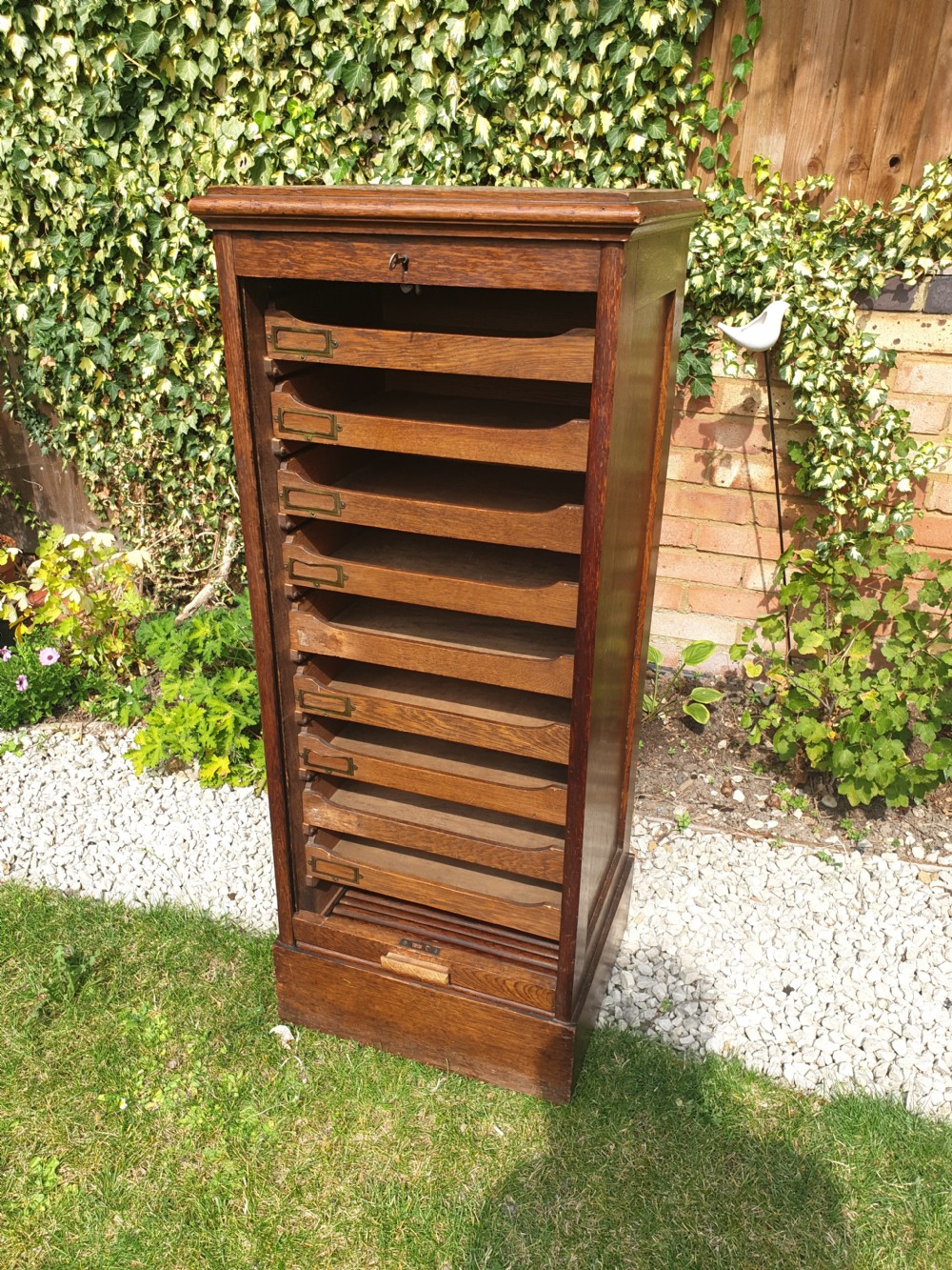 Early 20th century oak tambour front office cabinet.  View V