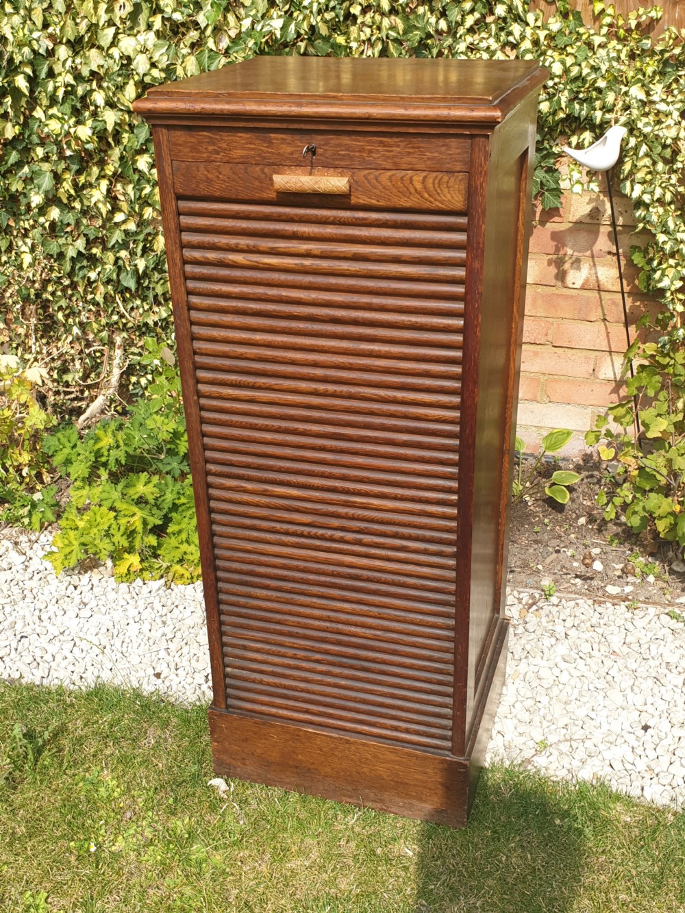 Early 20th century oak tambour front office cabinet.  View VI