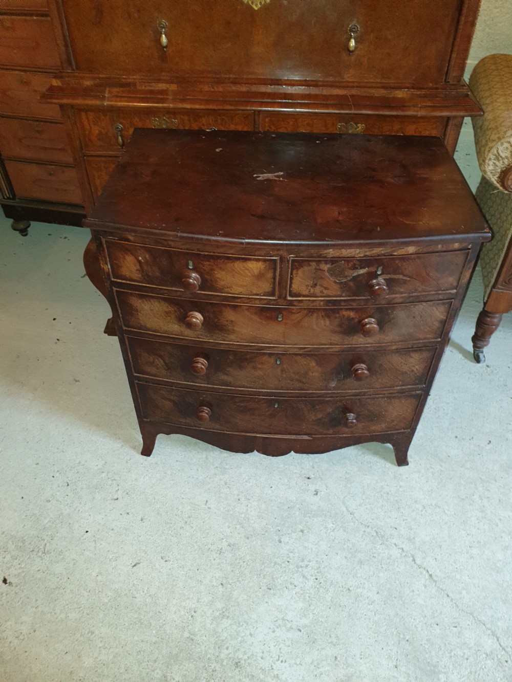 Diminutive mahogany bow front chest.