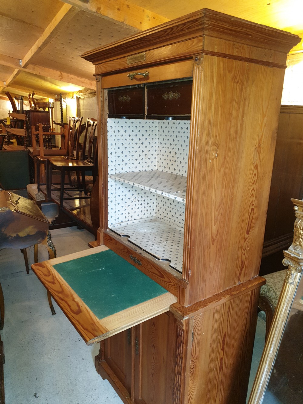 A tall Edwardian pine office cabinet featuring a slatted tambour roll shutter upper section above a two-door panelled lower cupboard. View III
