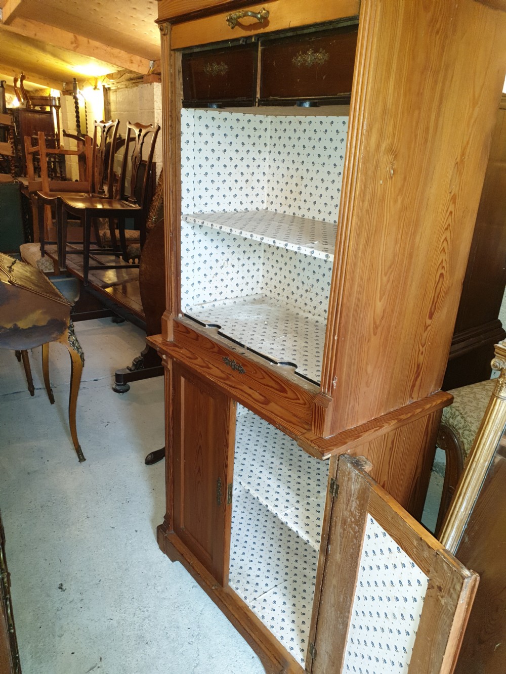 A tall Edwardian pine office cabinet featuring a slatted tambour roll shutter upper section above a two-door panelled lower cupboard. View V