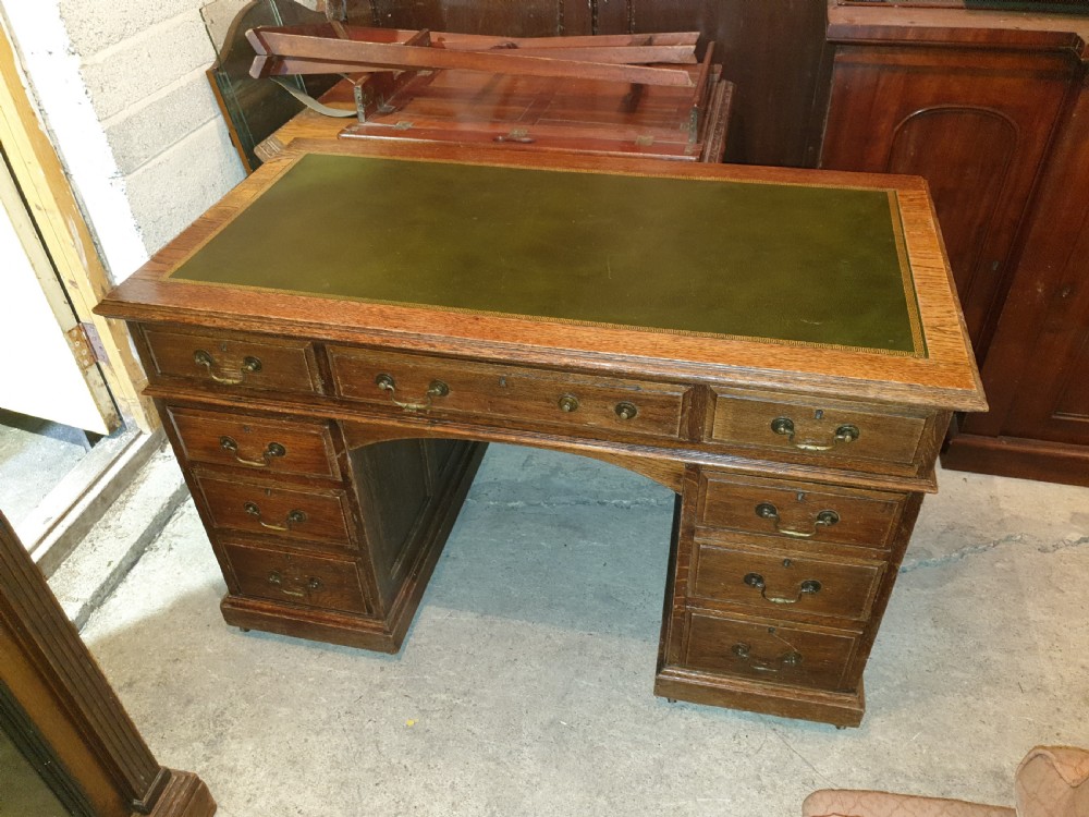 Neat Edwardian oak kneehole pedestal panelled desk.  View VI