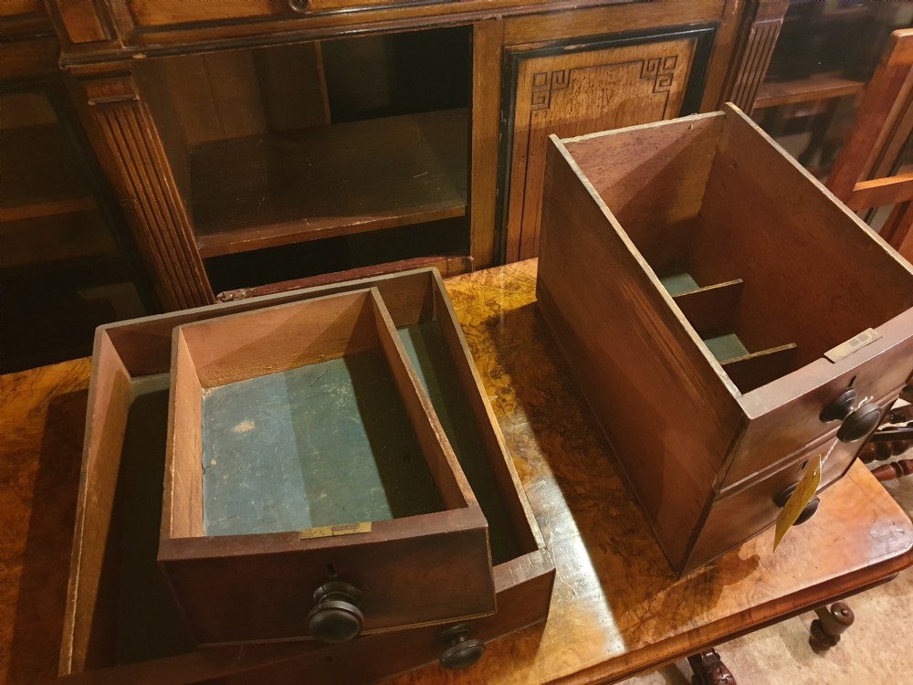 A nineteenth-century Regency mahogany bow-fronted sideboard featuring five drawers with turned wooden knobs and four turned legs. View IX