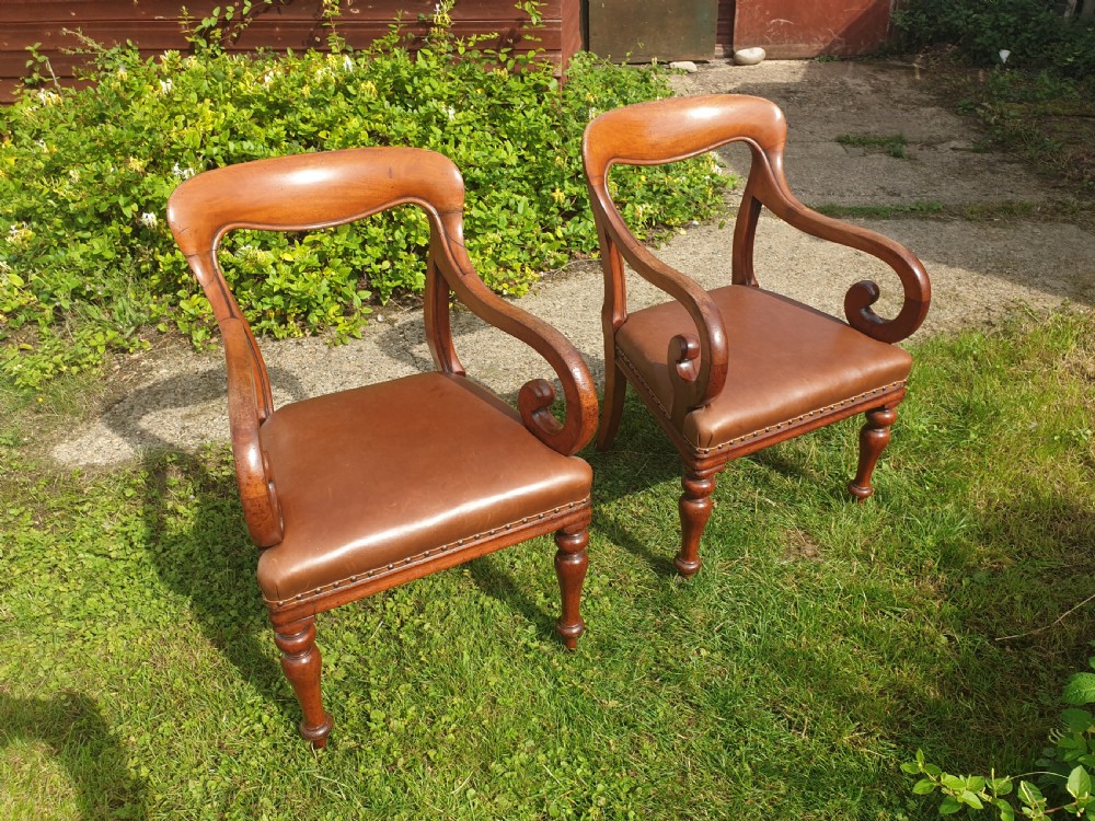 Pair of early Victorian mahogany desk armchairs