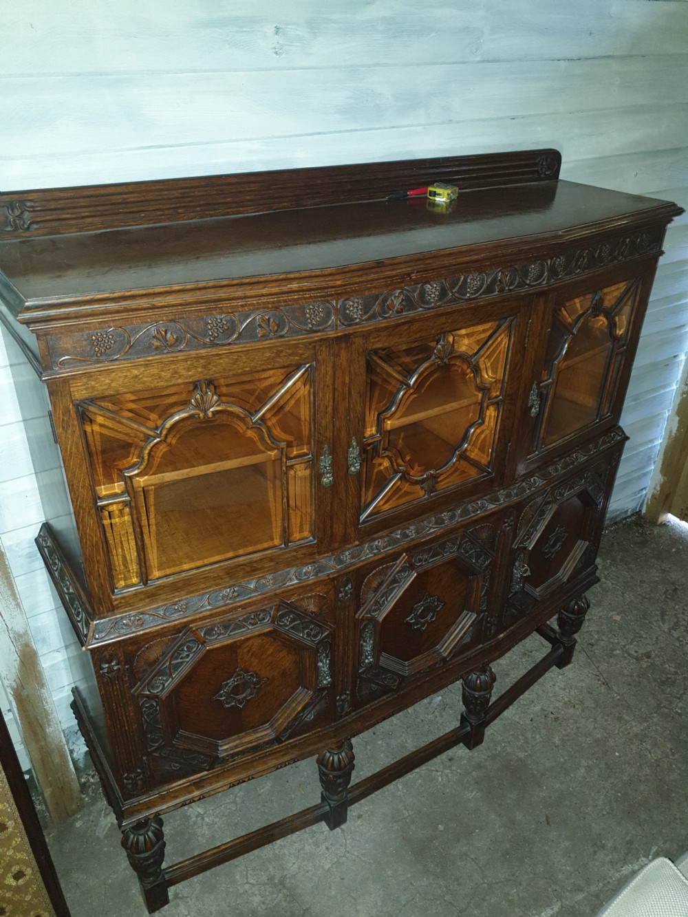 Good 1920s carved oak 2 part side cabinet 