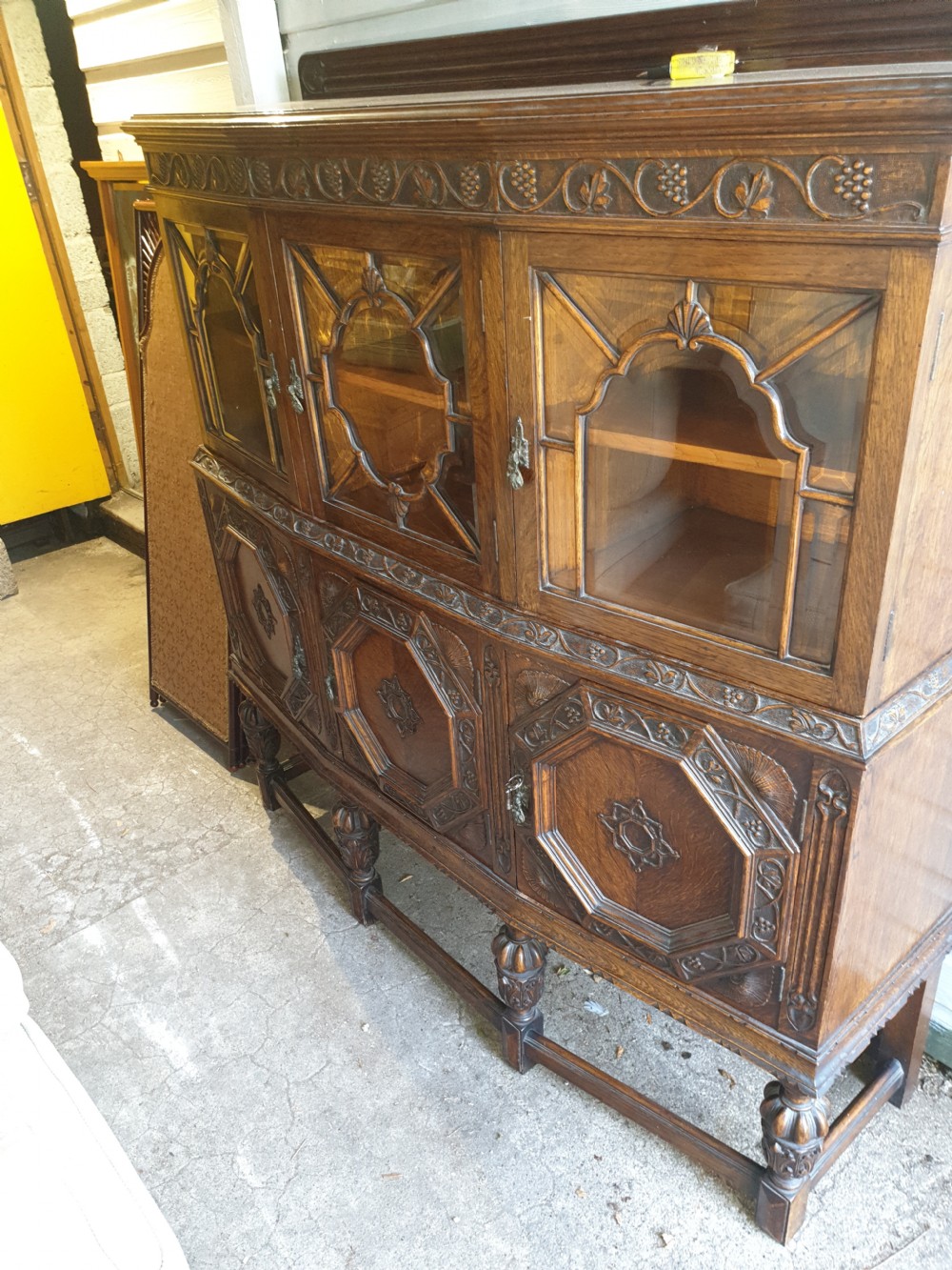 Good 1920s carved oak 2 part side cabinet  View II
