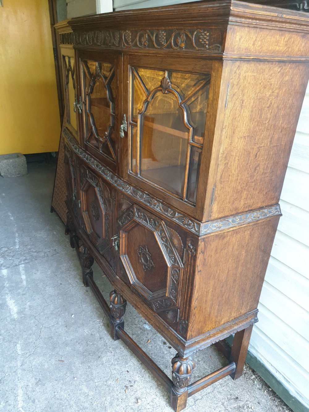 Good 1920s carved oak 2 part side cabinet  View III