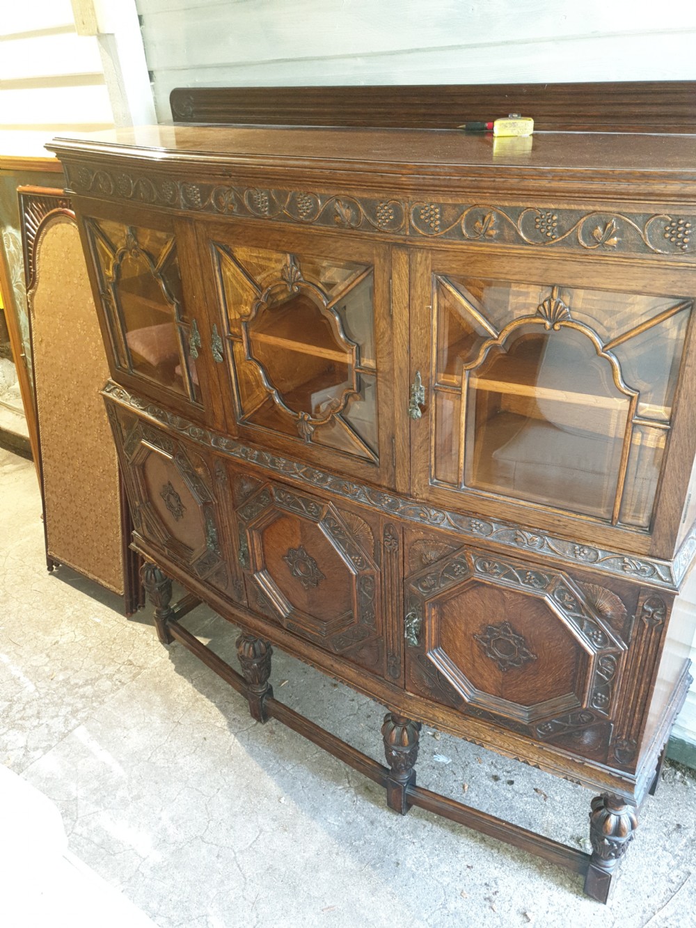 Good 1920s carved oak 2 part side cabinet  View IV