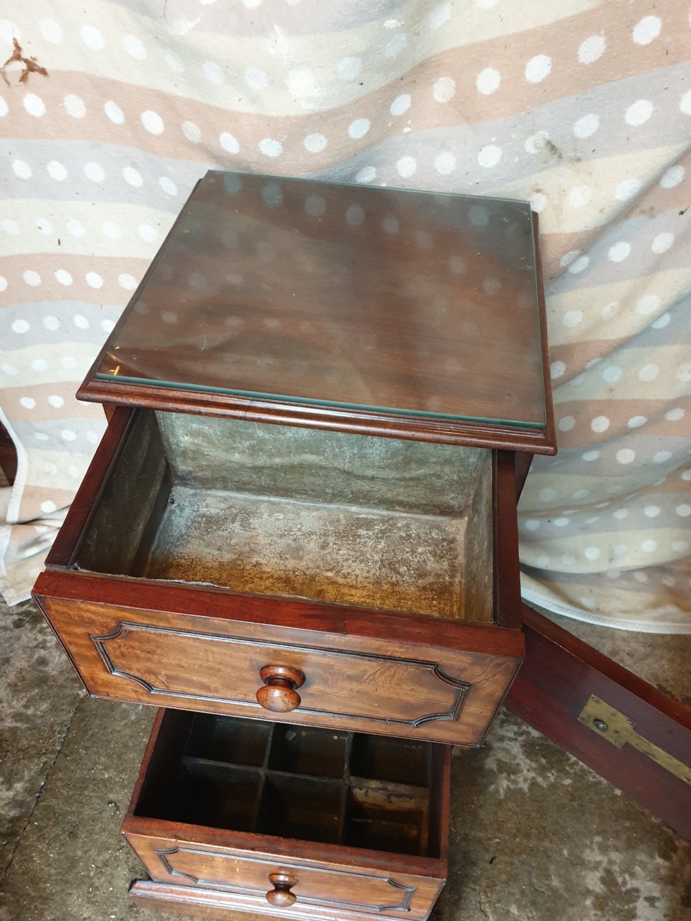 An early nineteenth-century mahogany cabinet-style wine cooler featuring a removable metal-lined top box, drawers with internal bottle dividers, moulded panels, turned wooden knobs, and a hinged side door. View II
