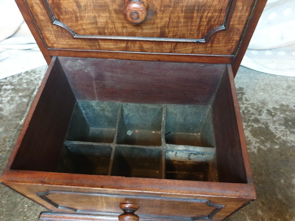 An early nineteenth-century mahogany cabinet-style wine cooler featuring a removable metal-lined top box, drawers with internal bottle dividers, moulded panels, turned wooden knobs, and a hinged side door. View IV
