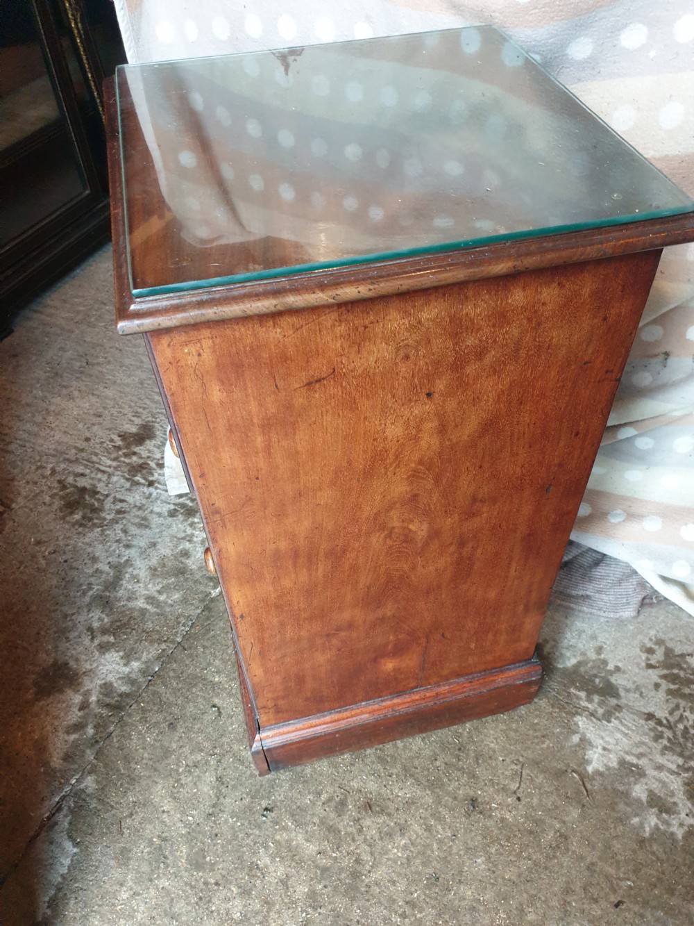 An early nineteenth-century mahogany cabinet-style wine cooler featuring a removable metal-lined top box, drawers with internal bottle dividers, moulded panels, turned wooden knobs, and a hinged side door. View VI