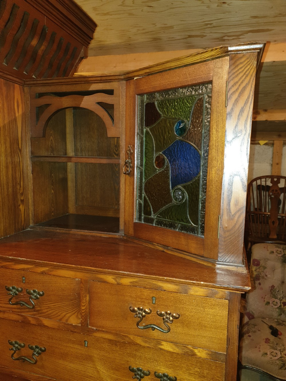 An Arts and Crafts ash bedroom suite featuring a multi-functional compactum wardrobe with leaded glass, a dressing table with mirror, and a tiled washstand with marble surface. View V
