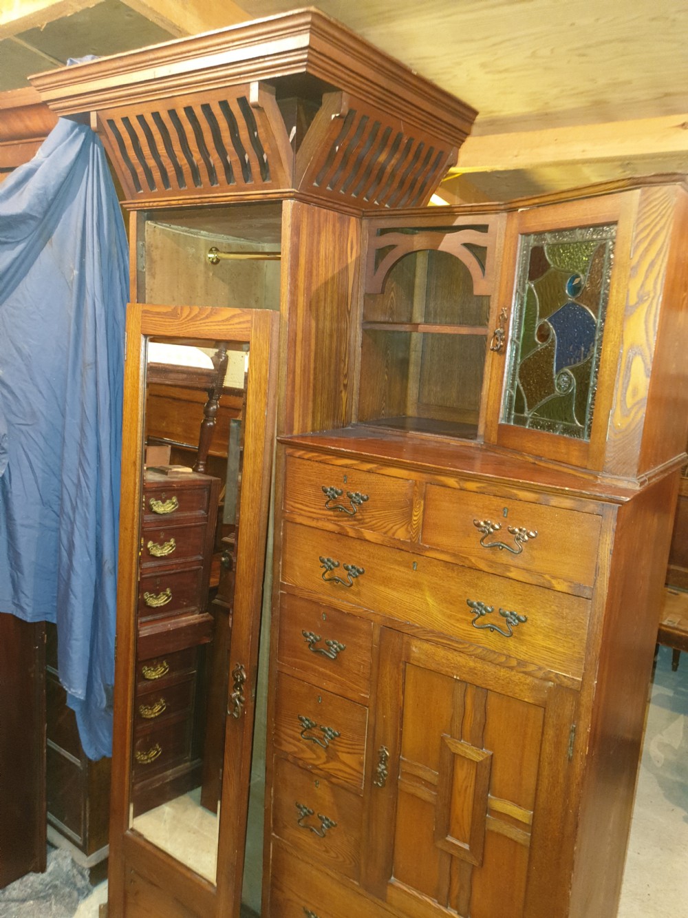 An Arts and Crafts ash bedroom suite featuring a multi-functional compactum wardrobe with leaded glass, a dressing table with mirror, and a tiled washstand with marble surface. View VI