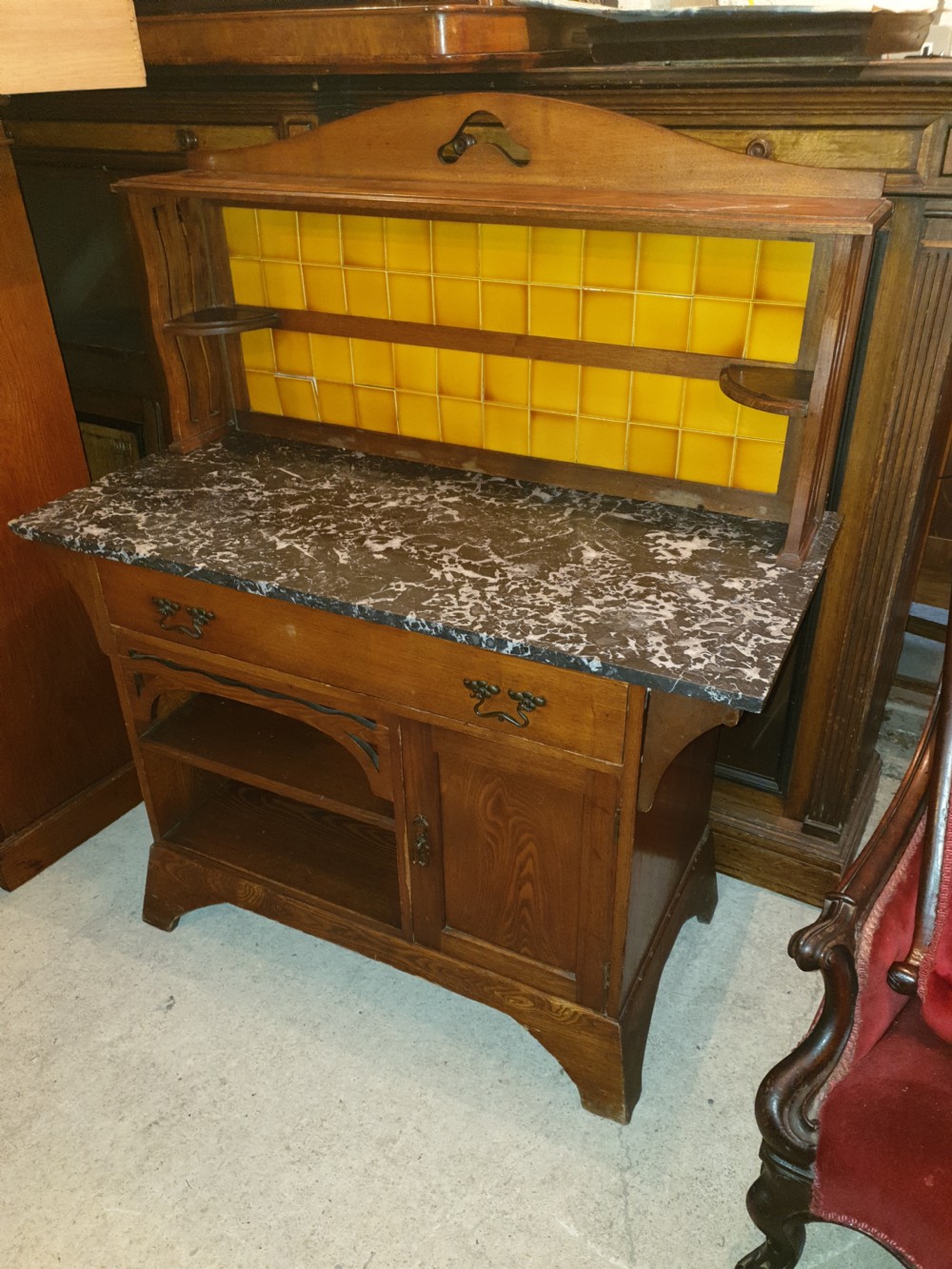 An Arts and Crafts ash bedroom suite featuring a multi-functional compactum wardrobe with leaded glass, a dressing table with mirror, and a tiled washstand with marble surface. View VII