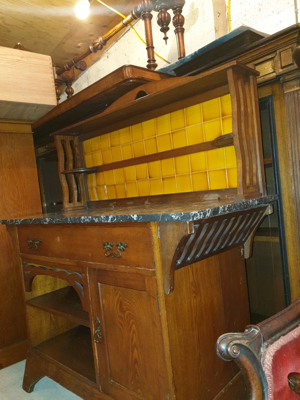 An Arts and Crafts ash bedroom suite featuring a multi-functional compactum wardrobe with leaded glass, a dressing table with mirror, and a tiled washstand with marble surface. View VIII