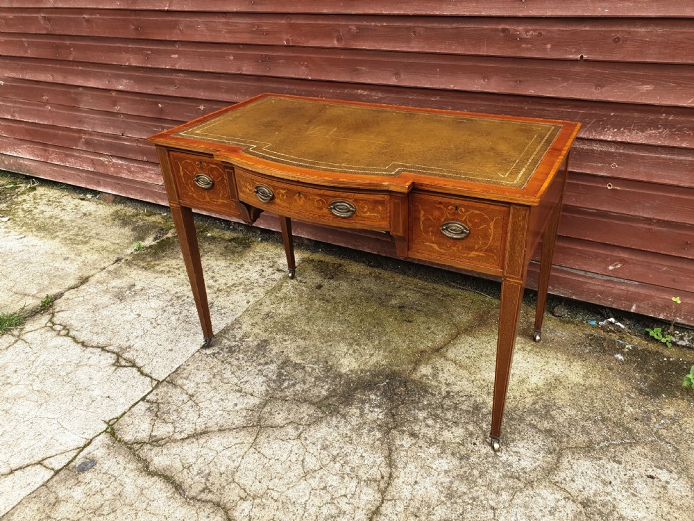 Edwardian inlaid mahogany writing table. By Maple & Co.