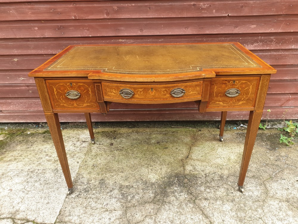 Edwardian inlaid mahogany writing table. By Maple & Co. View II