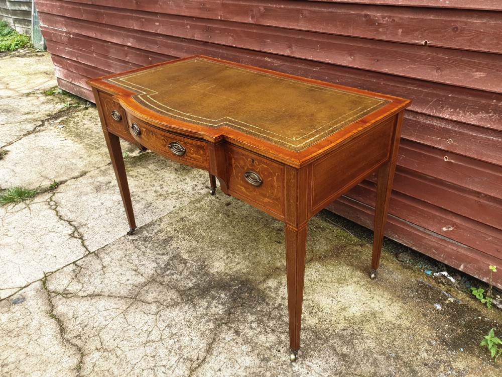 Edwardian inlaid mahogany writing table. By Maple & Co. View III