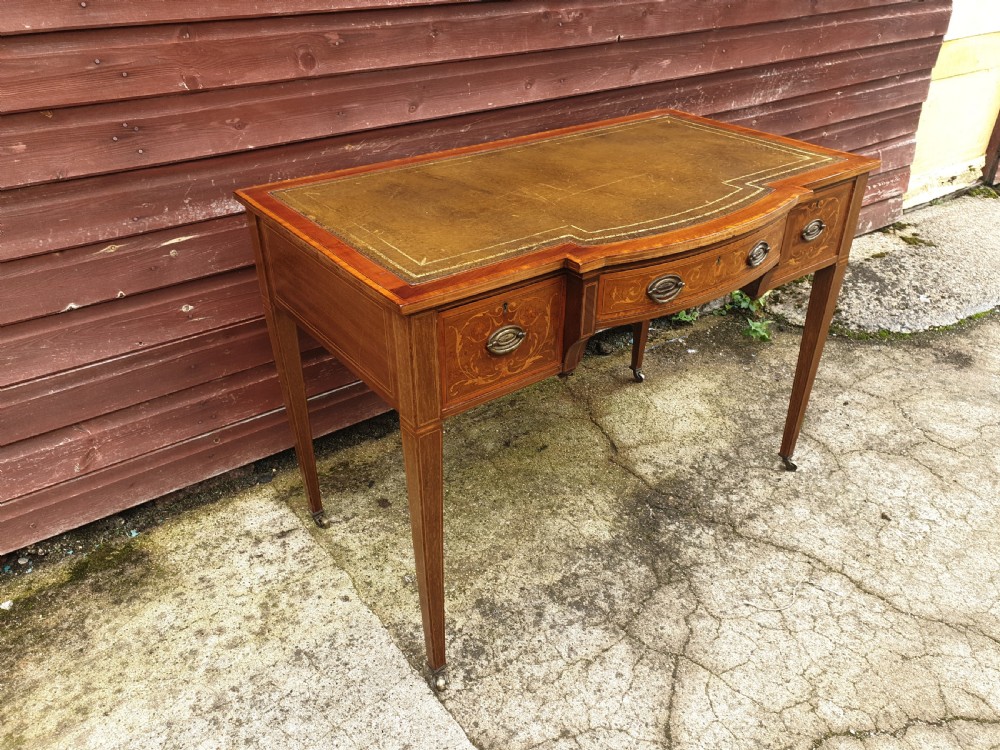 Edwardian inlaid mahogany writing table. By Maple & Co. View IV