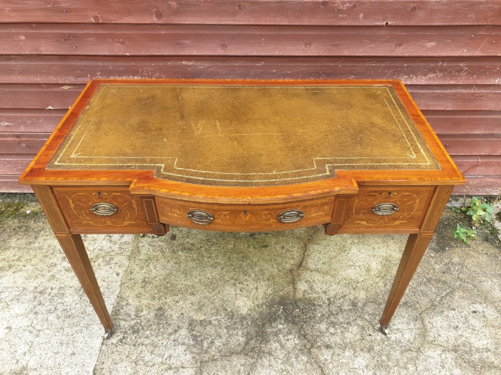 Edwardian inlaid mahogany writing table. By Maple & Co. View VI