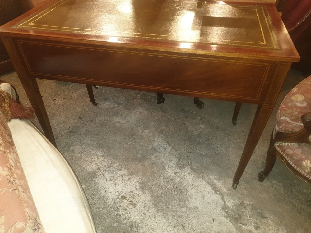 Edwardian inlaid mahogany writing table. By Maple & Co. View VII