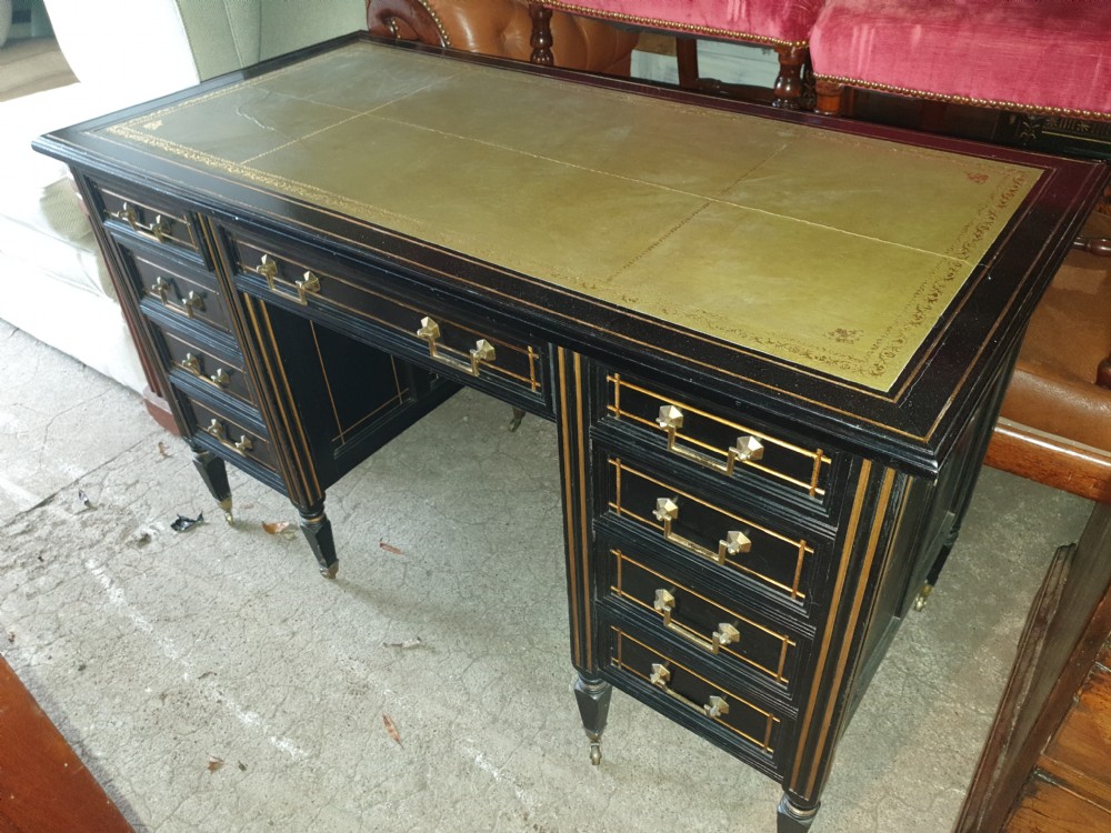 Victorian ebonised and gilt highlighted kneehole pedestal desk 