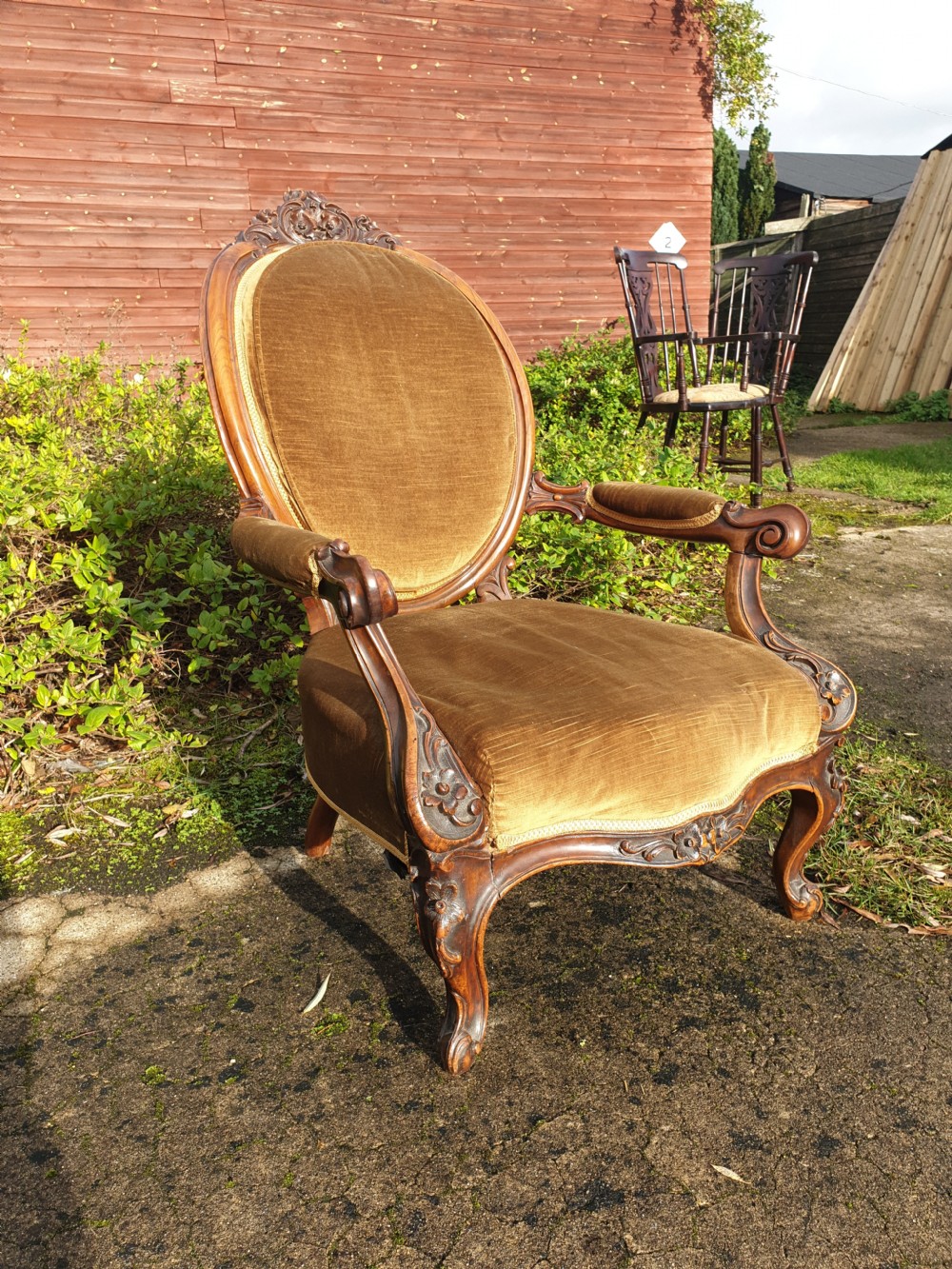 Mid Victorian carved walnut framed spoon back armchair.  View III