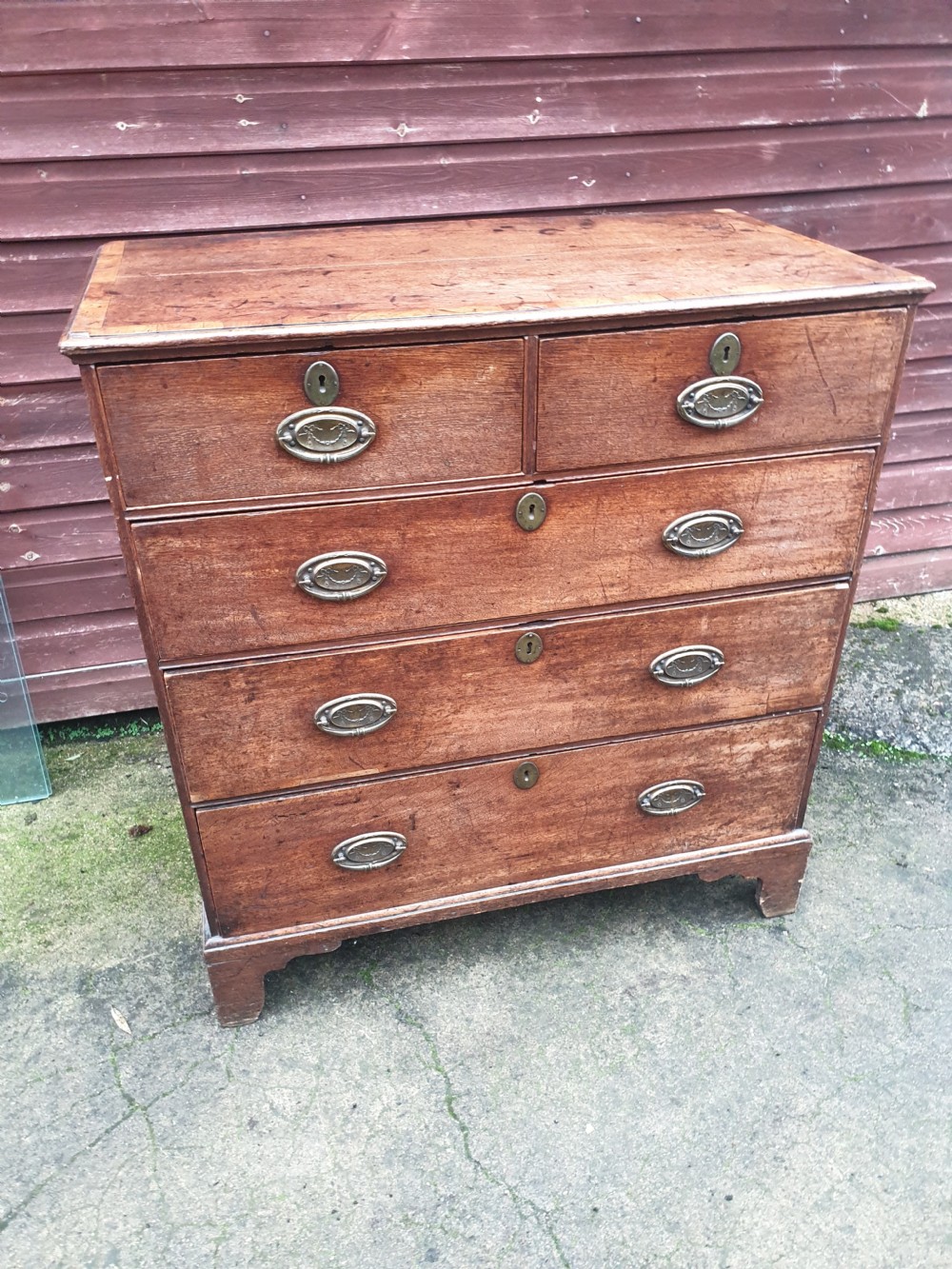 Late Georgian oak chest of drawers.  View IV