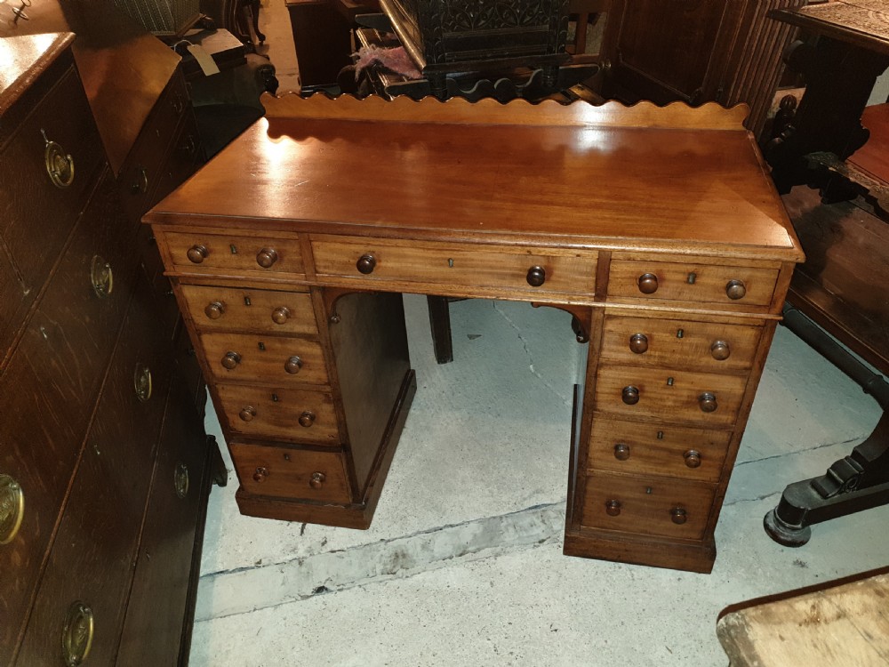 Mid 19th century kneehole pedestal desk.  View II
