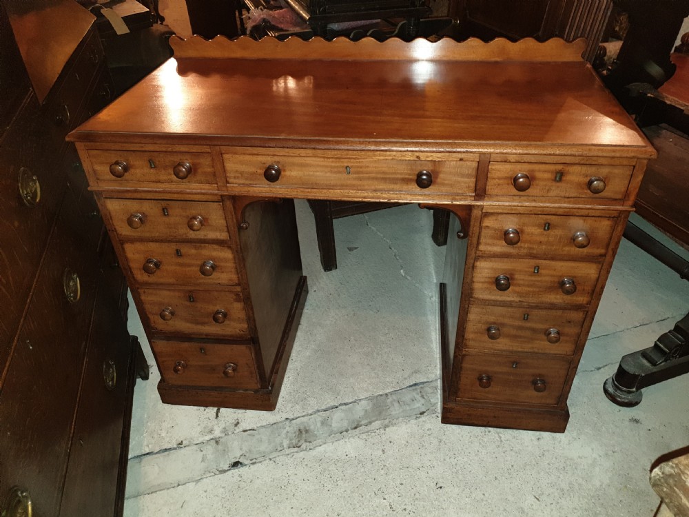 Mid 19th century kneehole pedestal desk.  View V