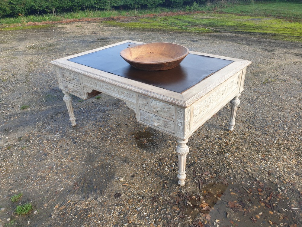 Large carved limed oak partners writing desk 