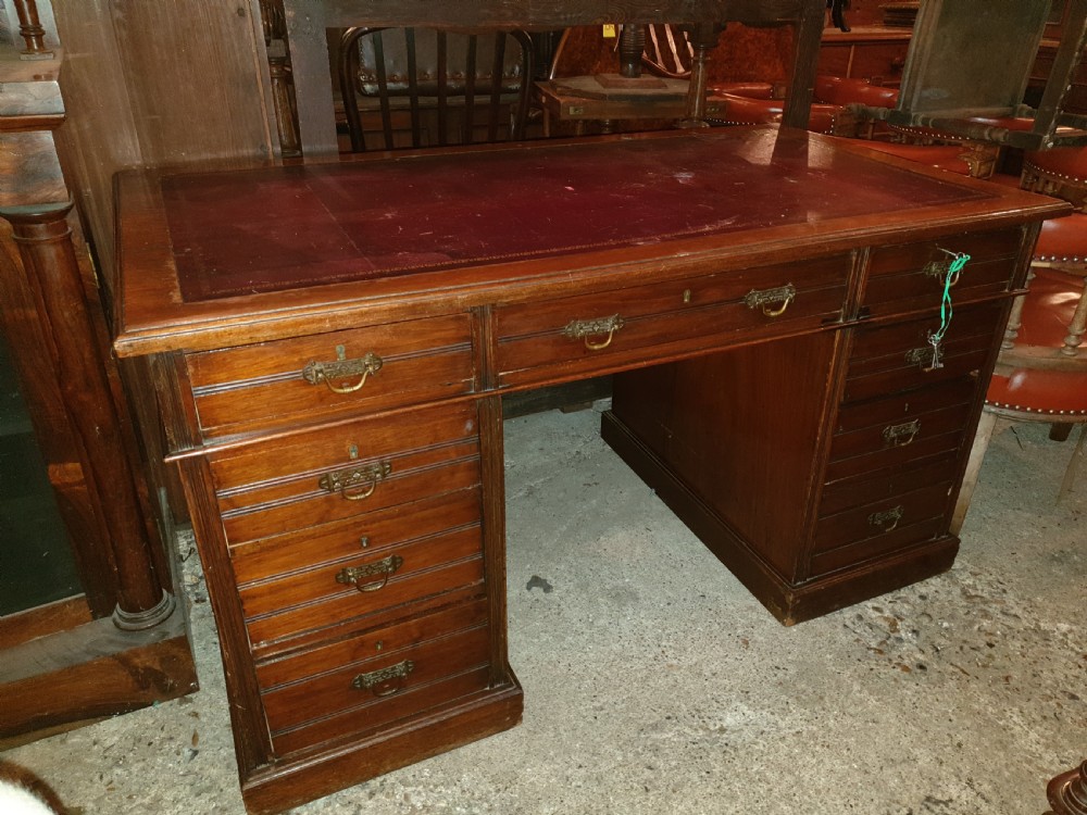 Late Victorian kneehole pedestal desk with makers stamp.  View II