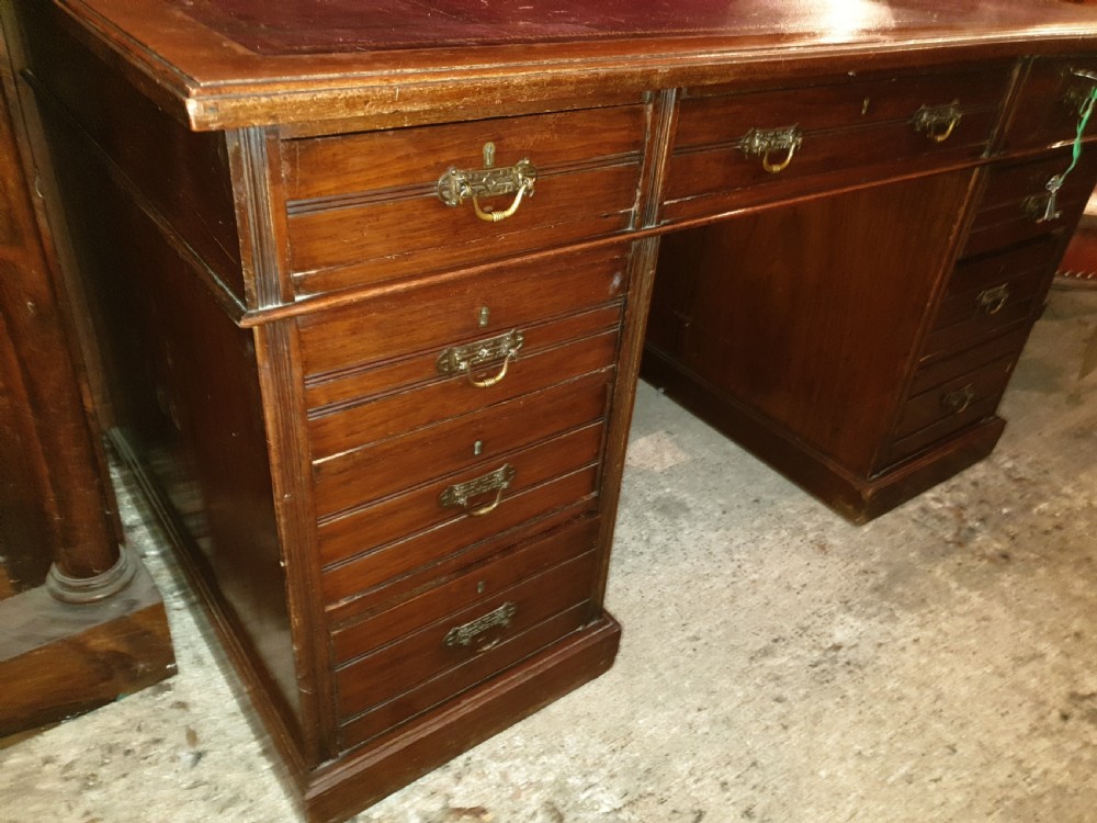Late Victorian kneehole pedestal desk with makers stamp.  View III