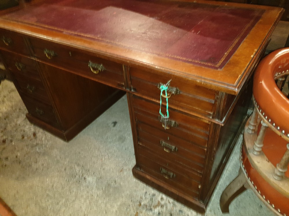 Late Victorian kneehole pedestal desk with makers stamp.  View IV
