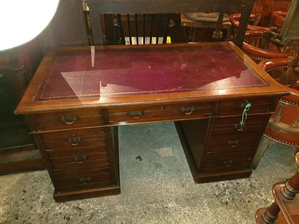 Late Victorian kneehole pedestal desk with makers stamp.  View V