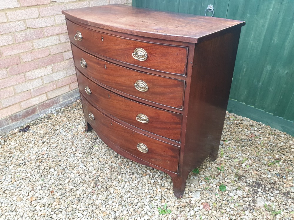 Late Georgian mahogany bow front chest. View II