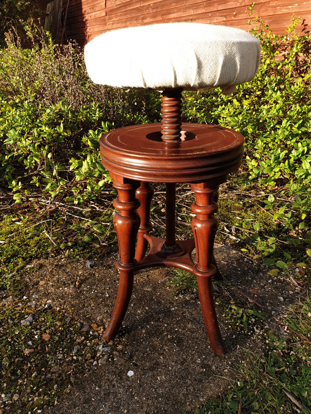 Regency mahogany revolving piano stool.