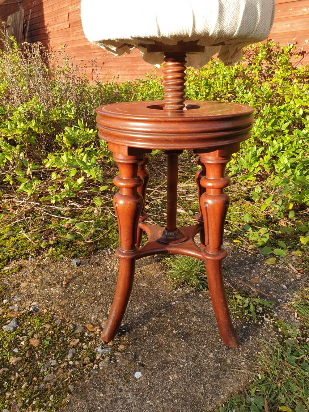 Regency mahogany revolving piano stool. View II