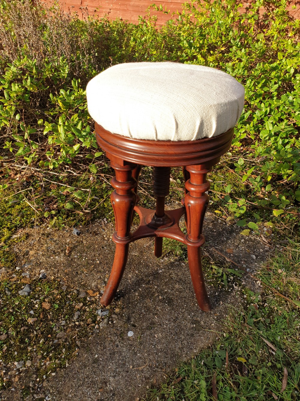 Regency mahogany revolving piano stool. View III